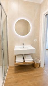 a bathroom with a sink and a mirror at B&B Venere Rooms in Pimonte