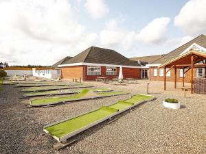a row of lounges in front of a building at 6 person holiday home in Rømø-By Traum in Sønderby