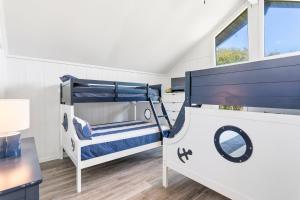 a bedroom with a bunk bed and a desk at 4068 - Family Tradition in Kitty Hawk +47 photos