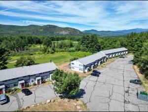 an aerial view of a building with a parking lot at Central White Mountains Retreat in Bartlett