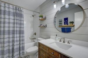 a bathroom with a sink and a toilet and a mirror at Central White Mountains Retreat in Bartlett +22 photos