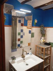 a bathroom with a sink and a mirror at Torreta de Sant Tomàs in Cocentaina +25 photos