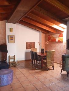 a dining room with a table and chairs at Torreta de Sant Tomàs in Cocentaina