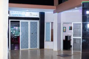 an entrance to a store with a glass door at Serenus Lounge in Senge