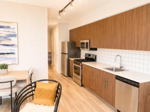 a kitchen with a sink and a counter top at Lovely Brand New Suite in Sidney