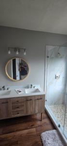 a bathroom with a sink and a mirror at Boho Chic Lovely Garden Home in Spring +22 photos