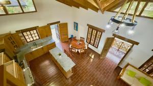 an overhead view of a kitchen and a dining room at Villa Ana Rosa in Jarabacoa +13 photos