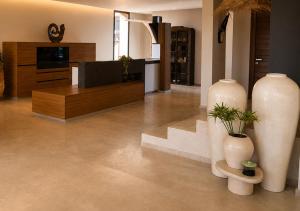 a living room with two large vases and a tv at Villa Émeraude 5 Ch in Marrakesh +16 photos