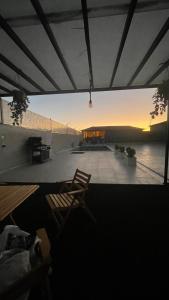 a view of a patio with a table and chairs at Sadeel chalet in Kerak