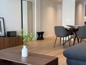 a living room with a table and chairs at Gerês River Terrace in Geres