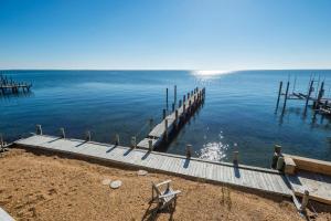 a dock on a body of water with at Serenity Now in Greenbackville