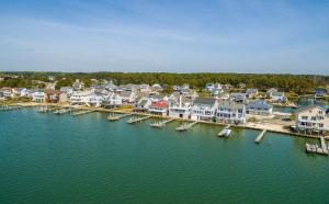 an aerial view of a harbor with houses and boats at Serenity Now in Greenbackville