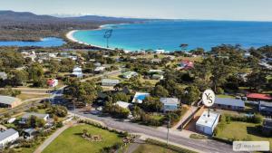 an aerial view of a small town next to the ocean at Bay Days - Binalong Bay in Binalong Bay
