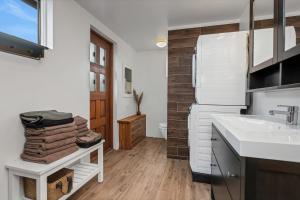 a kitchen with a sink and a refrigerator at Myrarkot Country Home in Selfoss +29 photos