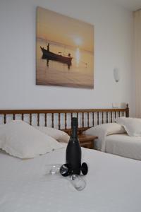 Posteľ alebo postele v izbe v ubytovaní Hostal Pereiriña