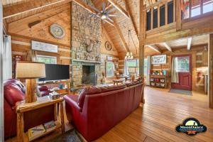 a living room with a couch and a fireplace at Dogwood Hills in Nashville
