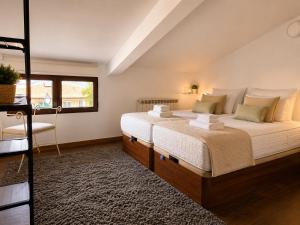 a bedroom with a large bed and a window at Vistapeña in Piedrahita +49 photos