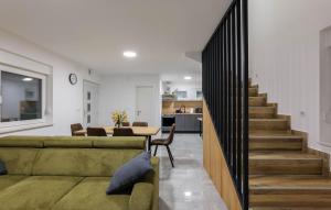 a living room with a couch and a dining room at Amazing Home In Banfi in Štrigova