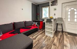 a living room with a couch and a table at Lovely Home In Podhum With House A Panoramic View in Podhum