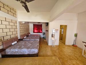 a room with two beds and a table in it at Casa Amarilla in Barrio Nuevo +22 photos
