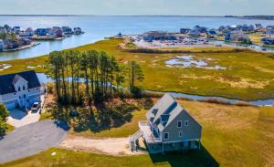 an aerial view of a house on an island in the water at The Baywatch Bungalow in Greenbackville
