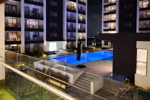 a swimming pool in the middle of a building at Desired Atmosphere Safaris in Nairobi