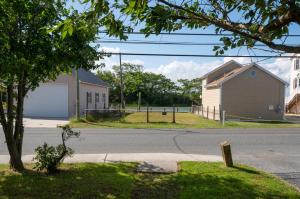 an intersection of a street with a church and a house at The Mane Escape in Chincoteague +36 photos