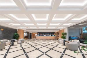 an office lobby with a coffered ceiling at Tangshan Yipin Hot Spring Hotel in Nanjing