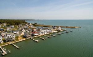 an aerial view of a harbor with houses and boats at The Sweets Spot in Greenbackville +11 photos