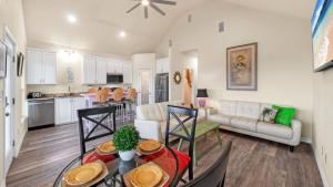 a kitchen and living room with a table and chairs at Laguna Sunset by AvantStay in Corpus Christi