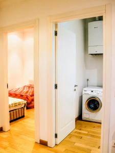 a door to a laundry room with a washing machine at Sanremo Apartments - Orchidea in Sanremo