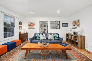 a living room with a couch and a coffee table at To the Lighthouse in Birch Town