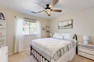 a bedroom with a bed and a ceiling fan at 1 Mi to Lake Tulloch: Home w/ Patio Oasis & Pool in Copper Cove Subdivision +17 photos