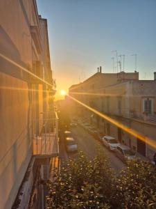 a view of a street at sunset from a building at Vico V - Molfetta Premium Apartment - Central, Near Port, New - Fast Wi-Fi in Molfetta