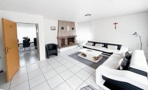 a living room with a couch and a fireplace at Einfamilienhaus in Amriswil in Amriswil