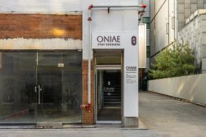 an entrance to a building with a glass door at Onjae Stay Seongsu in Seoul