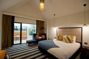 Llit o llits en una habitació de The Ellen Hotel, an Ascend Collection Hotel