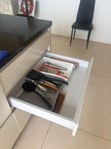 a drawer in a counter with some utensils in it at NEW, Modern 1BR with Pool-Kitchen-Workspace-100Mb in Badung