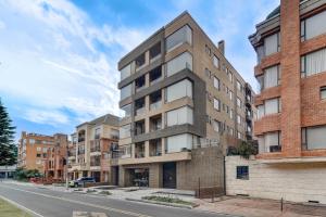 an apartment building on the corner of a street at Hotel EspacioYa By Mario Rental 103 in Bogotá