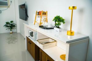 a kitchen with a counter with a microwave on it at Casa Marelle in Lapu Lapu City +16 photos