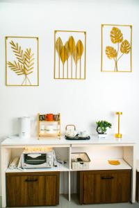 a white desk in a room with four pictures on the wall at Casa Marelle in Lapu Lapu City