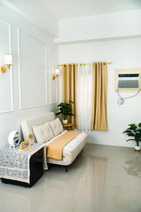 a room with a bed and a window in it at Casa Marelle in Lapu Lapu City