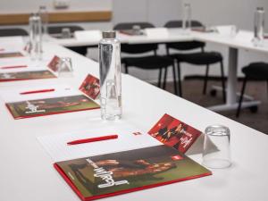 a glass bottle sitting on top of a table at ibis Nogent Sur Marne RÉNOVÉ EN 2025 in Nogent-sur-Marne