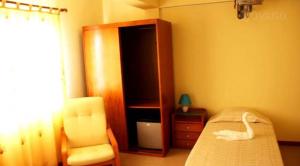 A bed or beds in a room at Hotel Lazareto