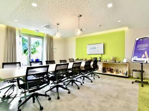 a conference room with a long table and chairs at Mercure Nantes Centre Gare in Nantes