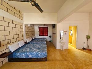 a bedroom with a bed in a brick wall at Casa Golden in Barrio Nuevo +18 photos
