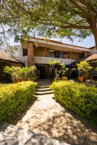 a building with a pathway in front of it at Casa Gulal in Teotitlán del Valle