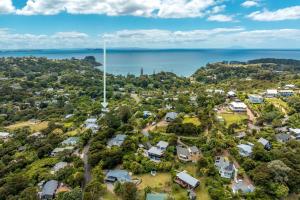 an aerial view of a neighbourhood with houses and the ocean at Paradise at Palm Beach in Palm Beach