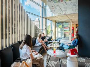 a group of women sitting in a waiting room at Ibis Warszawa Stare Miasto in Warsaw