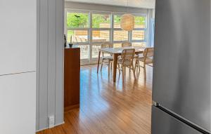 a kitchen and dining room with a table and chairs at 2 Bedroom Stunning Home In Vordingborg in Vordingborg